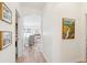 Hallway leads to the home's main living area, filled with art and light at 1651 Valley Oak Rd, Johns Island, SC 29455