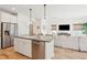 Open-concept kitchen featuring stainless appliances, a center island with bar seating, and stylish pendant lighting at 1651 Valley Oak Rd, Johns Island, SC 29455
