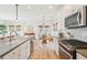 Bright, open kitchen featuring stainless appliances and a breakfast nook with views of the outdoors at 1651 Valley Oak Rd, Johns Island, SC 29455