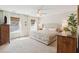 Spacious main bedroom with a ceiling fan and bright natural light from large windows at 1651 Valley Oak Rd, Johns Island, SC 29455