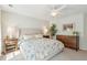 Comfortable main bedroom with a large bed, ceiling fan and soft natural light at 1651 Valley Oak Rd, Johns Island, SC 29455