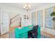 Bright office featuring a custom green desk, wood floors, natural light, and stairway access at 1651 Valley Oak Rd, Johns Island, SC 29455