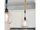 Close up view of pendant lighting fixtures with Edison bulbs above kitchen island at 1651 Valley Oak Rd, Johns Island, SC 29455
