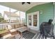 Relaxing screened porch with comfortable seating and an outdoor grill at 1651 Valley Oak Rd, Johns Island, SC 29455