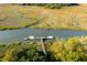 Stunning aerial view of a private boat dock on the marsh, offering direct access to the waterway at 178 Beresford Creek St, Daniel Island, SC 29492