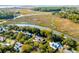Beautiful aerial view of a neighborhood with homes nestled along the waterway and lush green trees at 178 Beresford Creek St, Daniel Island, SC 29492