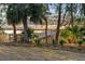 Scenic backyard with a wooden walkway leading to a private dock on the water, perfect for waterfront living at 178 Beresford Creek St, Daniel Island, SC 29492
