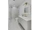 Bathroom vanity with white countertops, grey cabinets, gold hardware and glass shower at 178 Beresford Creek St, Daniel Island, SC 29492