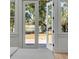Bedroom features an outdoor view from the French doors and windows at 178 Beresford Creek St, Daniel Island, SC 29492
