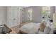 Airy bedroom with neutral tones and abundant natural light, creating a peaceful retreat for relaxation and rest at 178 Beresford Creek St, Daniel Island, SC 29492