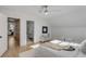 Bright bedroom with hardwood floors, neutral decor, and ensuite bathroom access at 178 Beresford Creek St, Daniel Island, SC 29492
