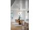 Bright dining room with modern light fixture, wooden table, and neutral decor at 178 Beresford Creek St, Daniel Island, SC 29492