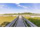 Marsh front home featuring a dock for easy water access and beautiful views at 178 Beresford Creek St, Daniel Island, SC 29492