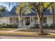 Charming two-story home with a welcoming front porch and well-manicured lawn at 178 Beresford Creek St, Daniel Island, SC 29492