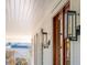 Detailed view of stylish gas lantern next to double front door at 178 Beresford Creek St, Daniel Island, SC 29492