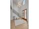 Elegant foyer with high ceilings, modern chandelier, and beautiful staircase at 178 Beresford Creek St, Daniel Island, SC 29492