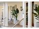 Inviting front porch with seating, elegant planters, and stylish exterior lighting at 178 Beresford Creek St, Daniel Island, SC 29492