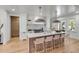 Bright kitchen with marble countertops, a large island, and modern appliances at 178 Beresford Creek St, Daniel Island, SC 29492