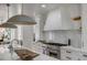 Luxurious kitchen with large island, quartz countertops and stainless steel appliances at 178 Beresford Creek St, Daniel Island, SC 29492