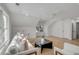 Bright living room with hardwood floors and white furniture at 178 Beresford Creek St, Daniel Island, SC 29492