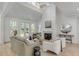Inviting living room with fireplace, neutral furniture, and access to the outdoors at 178 Beresford Creek St, Daniel Island, SC 29492