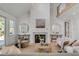 Bright living room with fireplace, neutral tones, and high ceilings creates a calming atmosphere at 178 Beresford Creek St, Daniel Island, SC 29492