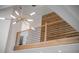 Modern loft featuring wood accents, metal railings, and contemporary lighting fixture at 178 Beresford Creek St, Daniel Island, SC 29492