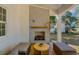 Inviting outdoor living space with a cozy fireplace, wood floors and comfortable seating at 178 Beresford Creek St, Daniel Island, SC 29492