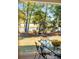 Outdoor seating area by the water, featuring rocking chairs, a fire pit, and a view of the water at 178 Beresford Creek St, Daniel Island, SC 29492