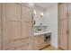 Walk-in pantry with custom wood cabinets, quartz countertop and built-in microwave at 178 Beresford Creek St, Daniel Island, SC 29492