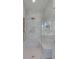 Luxurious shower featuring marble tiling, a built-in bench, and glass enclosure, blending style with functionality at 178 Beresford Creek St, Daniel Island, SC 29492