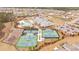 Aerial view of the community amenities featuring swimming pool, clubhouse, tennis courts, and sports fields at 178 Garden Gate Way, Summerville, SC 29486
