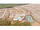 Aerial view showcases community featuring a pool, tennis courts, clubhouse, and well-planned residential layout at 178 Garden Gate Way, Summerville, SC 29486