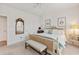 Serene bedroom with a stylish wicker bed, soft blue accents, and ample natural light at 178 Garden Gate Way, Summerville, SC 29486