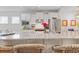 A modern kitchen featuring granite countertops, white cabinets, and stainless-steel appliances for an appealing aesthetic at 178 Garden Gate Way, Summerville, SC 29486