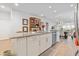 Spacious kitchen island with granite countertop, stainless steel appliances and modern fixtures overlook the dining area at 178 Garden Gate Way, Summerville, SC 29486