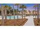 Stunning pool area with lush landscaping, cabanas, and a gazebo creating a resort-like ambiance at 178 Garden Gate Way, Summerville, SC 29486