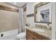 Bathroom with decorative mirror, wood trim and neutral color palette at 1861 Jaywood Cir, Charleston, SC 29407