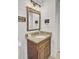 Stylish bathroom featuring a granite countertop and a modern lighting fixture at 1861 Jaywood Cir, Charleston, SC 29407