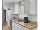 Bright kitchen featuring stainless steel appliances, granite counters, and white cabinets at 1861 Jaywood Cir, Charleston, SC 29407