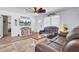 Comfortable living room featuring a mounted farmhouse TV, white walls and lots of natural light at 1861 Jaywood Cir, Charleston, SC 29407