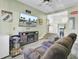 Inviting living room features a fireplace, TV, and open access to the kitchen at 1861 Jaywood Cir, Charleston, SC 29407