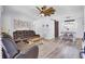 Cozy living room featuring rustic decor, wood floors, and a sliding barn door to the dining room at 1861 Jaywood Cir, Charleston, SC 29407