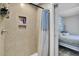 Shower room features neutral tile, shower niche, and a view into the bedroom at 1861 Jaywood Cir, Charleston, SC 29407