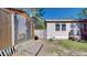 Backyard showcasing a shed, house, and some lawn, with an air conditioning unit on the side of the house at 1925 Old Parsonage Rd, Charleston, SC 29414