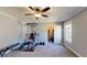 Bedroom with neutral paint, carpet, closet, window, and fitness equipment at 1925 Old Parsonage Rd, Charleston, SC 29414