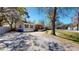 Charming home with a cozy front porch and well-maintained gravel driveway at 1925 Old Parsonage Rd, Charleston, SC 29414