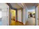 Hallway with tiled flooring leading to the bathroom and kitchen at 1925 Old Parsonage Rd, Charleston, SC 29414