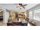 Open kitchen and dining area with wood cabinets, modern appliances, and bright windows at 1925 Old Parsonage Rd, Charleston, SC 29414