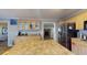 Well-lit kitchen with stainless steel appliances, ample cabinetry, and a view of the living area at 1925 Old Parsonage Rd, Charleston, SC 29414